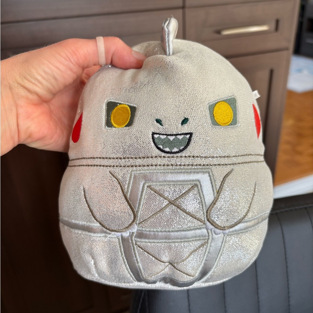 Silver Godzilla Plush Character with Yellow Eyes